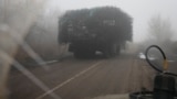 A Ukrainian armored vehicle fitted with metal wire armor on a road near Pokrovsk on November 23