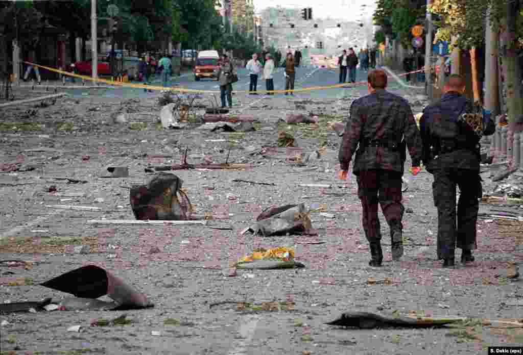 Rubble on the street beneath the General Staff Building in central Belgrade after a second strike on the building on the night of May 7, 1999.Then-US President Bill Clinton framed the bombing of Yugoslavia as a way to "to deter an even bloodier offensive against innocent [ethnic Albanian] civilians in Kosovo" by Serbian troops.