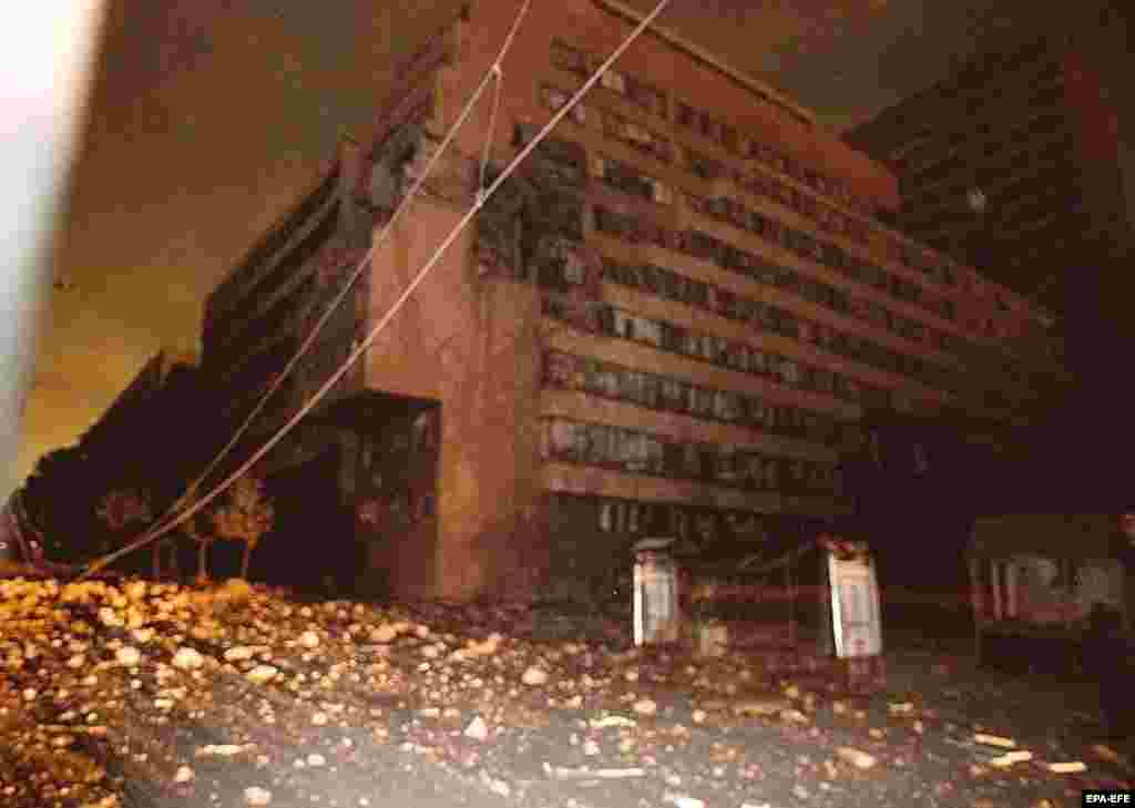 The General Staff Building seen immediately after the April 1999 NATO strikes.The building was unoccupied at the time, but two people were reportedly killed on the streets outside. The building was targeted again nine days later in a separate strike.